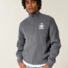 Afslappet grafisk sweater med lynlås