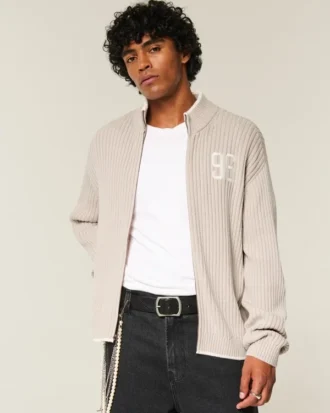 Afslappet sweater med grafisk lynlås