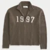 Afslappet sweater med grafisk lynlås