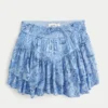 Asymmetrisk mini-skort med lagdelt kant Asymmetrisk mini-skort med lagdelt kant