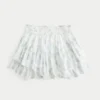 Asymmetrisk mini-skort med lagdelt kant Asymmetrisk mini-skort med lagdelt kant