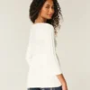 Babydoll-sweater i kabelstrik Babydoll-sweater i kabelstrik
