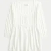 Babydoll-sweater i kabelstrik Babydoll-sweater i kabelstrik