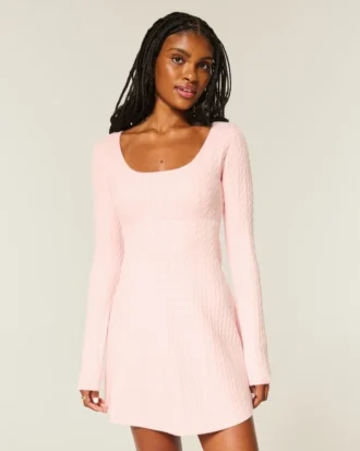 Babydoll-sweater-minikjole med bindebånd bagpå