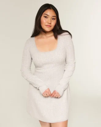Babydoll-sweater-minikjole med bindebånd bagpå