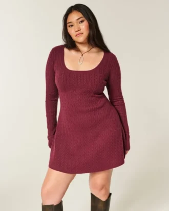 Babydoll-sweater-minikjole med bindebånd bagpå