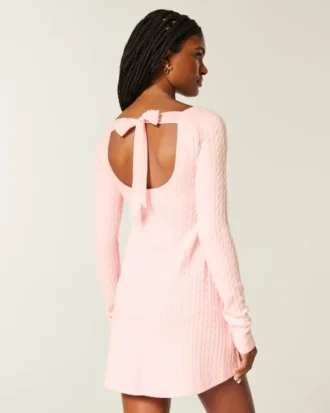 Babydoll-sweater-minikjole med bindebånd bagpå