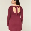 Babydoll-sweater-minikjole med bindebånd bagpå