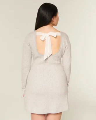 Babydoll-sweater-minikjole med bindebånd bagpå