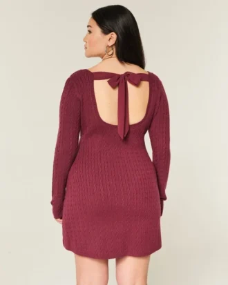 Babydoll-sweater-minikjole med bindebånd bagpå