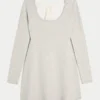 Babydoll-sweater-minikjole med bindebånd bagpå