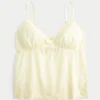 Babydoll-top med broderi og glimmer