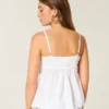 Babydoll-top med broderi og glimmer Babydoll-top med broderi og glimmer
