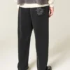 Baggy sweatpants med broderet edderkop Baggy sweatpants med broderet edderkop