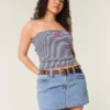 Curvy lavtaljet mini-skort i mediumvasket denim Curvy lavtaljet mini-skort i mediumvasket denim
