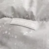 Faux fur-foret pufferjakke med hætte Faux fur-foret pufferjakke med hætte