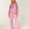 Glitrende rosenmotiv Sweatpants med brede ben Glitrende rosenmotiv Sweatpants med brede ben