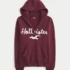 Hættetrøje med lynlås, logo og kant i imiteret pels Hættetrøje med lynlås, logo og kant i imiteret pels