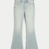 Højtaljede, lysvaskede jeans med stjerneformede lommer Højtaljede, lysvaskede jeans med stjerneformede lommer