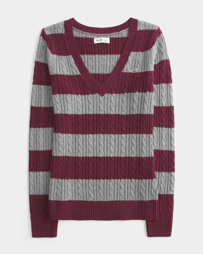 Ikonisk sweater med V-hals og kabelstrik