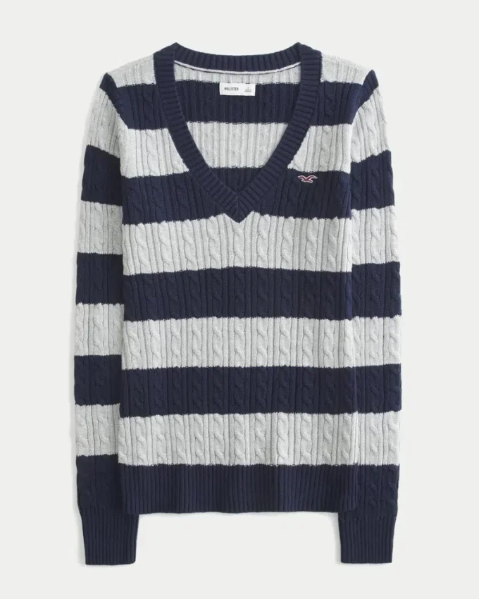 Ikonisk sweater med V-hals og kabelstrik