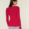 Ikonisk sweater med V-hals og kabelstrik