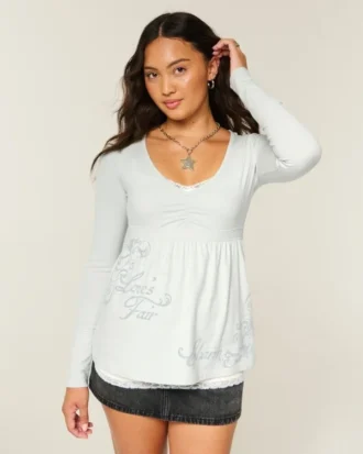Langærmet babydoll-top med grafisk print og pinch bust