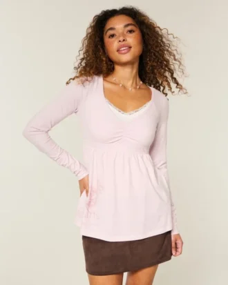 Langærmet babydoll-top med grafisk print og pinch bust