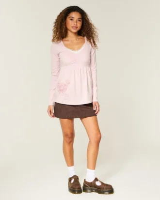 Langærmet babydoll-top med grafisk print og pinch bust