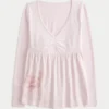 Langærmet babydoll-top med grafisk print og pinch bust Langærmet babydoll-top med grafisk print og pinch bust