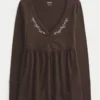 Langærmet babydoll-top med klemning ved brystet Langærmet babydoll-top med klemning ved brystet