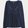 Langærmet babydoll-top med klemning ved brystet Langærmet babydoll-top med klemning ved brystet