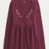 Langærmet babydoll-top med klemning ved brystet Langærmet babydoll-top med klemning ved brystet