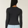 Langærmet sømløs baby-T-shirt i strik