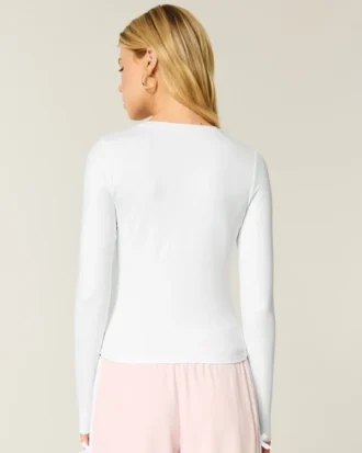 Langærmet sømløs baby-T-shirt i strik