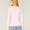 Langærmet sømløs baby-T-shirt i strik