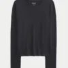Langærmet sømløs baby-T-shirt i strik