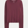 Langærmet sømløs baby-T-shirt i strik
