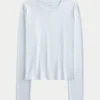 Langærmet sømløs baby-T-shirt i strik