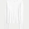 Langærmet sømløs baby-T-shirt i strik