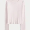 Langærmet sømløs baby-T-shirt i strik