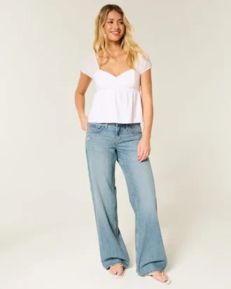 Lavtaljede baggy jeans i medium vask med sommerfuglemotiv