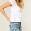 Lavtaljede baggy jeans i medium vask med sommerfuglemotiv Lavtaljede baggy jeans i medium vask med sommerfuglemotiv