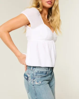 Lavtaljede baggy jeans i medium vask med sommerfuglemotiv