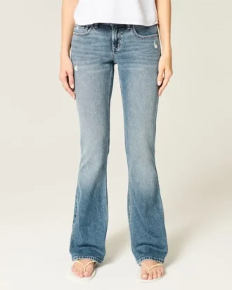 Lavtaljede bootcut-jeans i medium vask med distressed-effekt