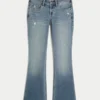 Lavtaljede bootcut-jeans i medium vask med distressed-effekt