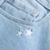 Lavtaljede bootcut-jeans med stjernebroderi Lavtaljede bootcut-jeans med stjernebroderi