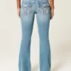 Lavtaljede jeans med medium vask og broderede blomster og bootcut-ben Lavtaljede jeans med medium vask og broderede blomster og bootcut-ben