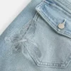Lavtaljede jeans med mellemvask og broderet sommerfugl i bootcut-pasform Lavtaljede jeans med mellemvask og broderet sommerfugl i bootcut-pasform
