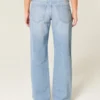 Lavtaljede, lysvaskede baggy jeans med nitter og sløjfer Lavtaljede, lysvaskede baggy jeans med nitter og sløjfer